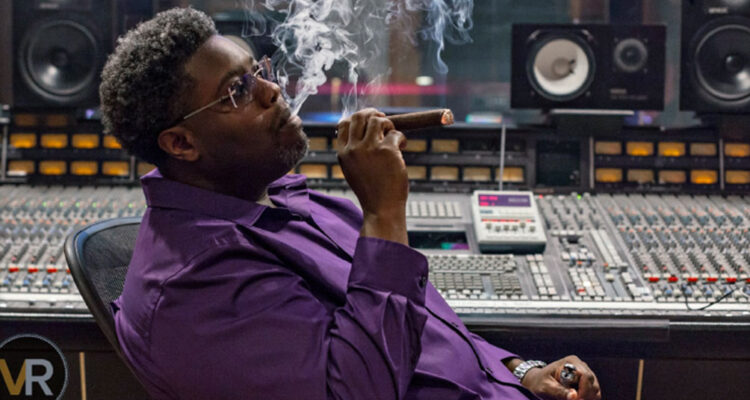 photo of CEO in recording studio smoking a cigar